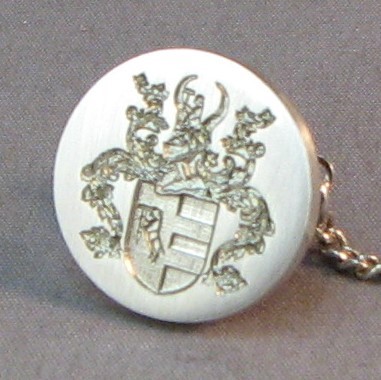 coat of arms dress stud close up