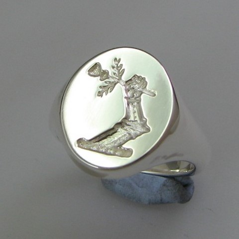 Arm and thistle crest engraved signet ring